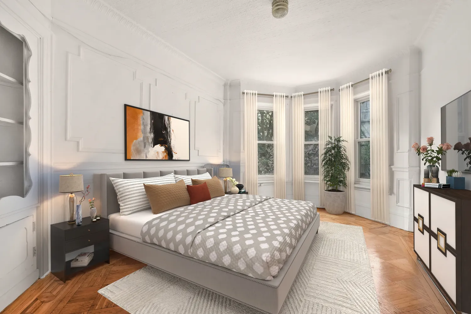 a bedroom with a large bed and a large window