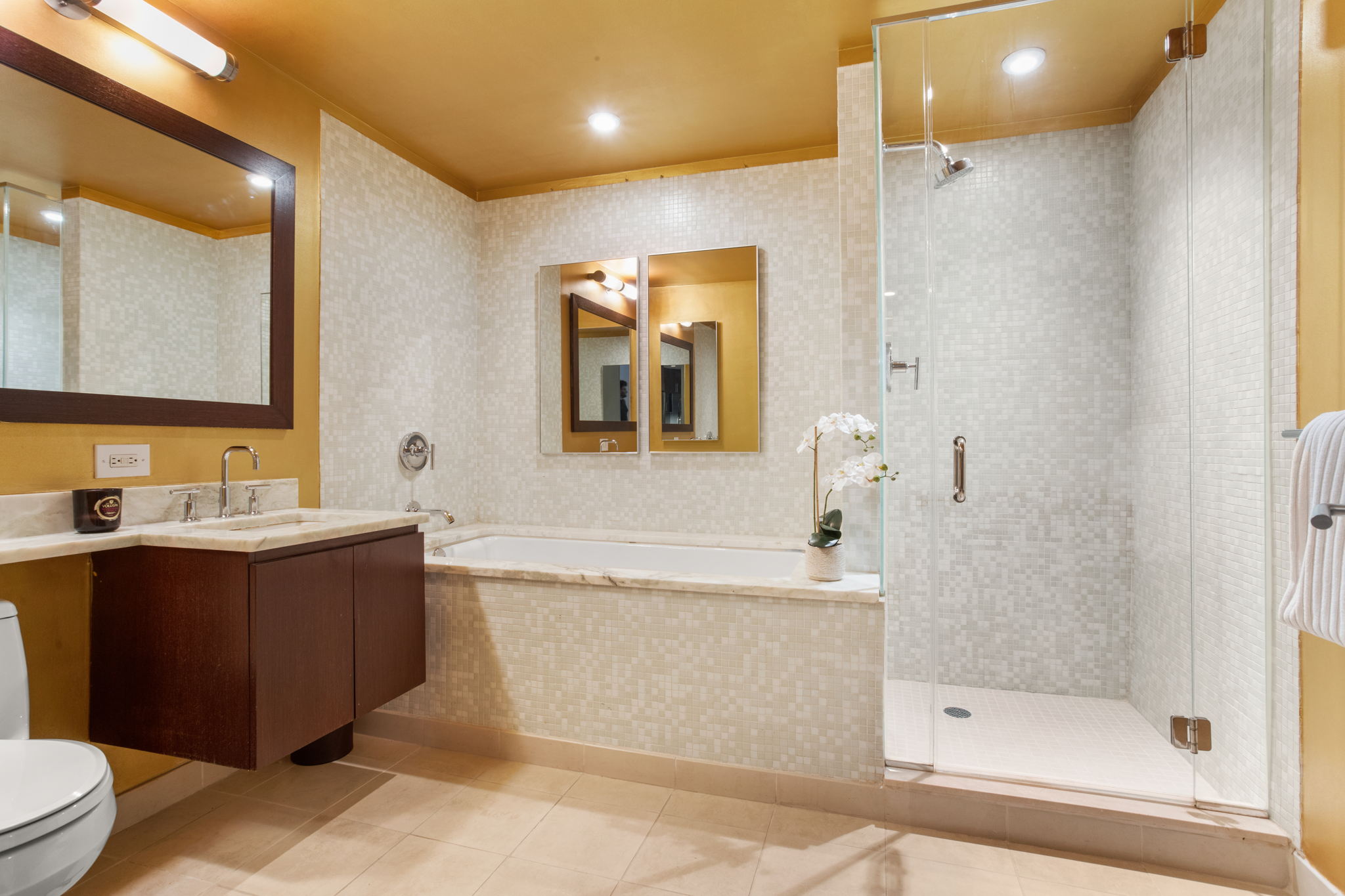 350 West 53rd Street, Unit THG Manhattan, NY 10019 - Photo 11 of 25 a bathroom with a bathtub shower sink and mirror