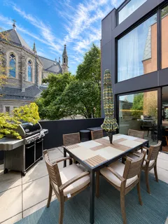 a view of a patio with a table and chairs