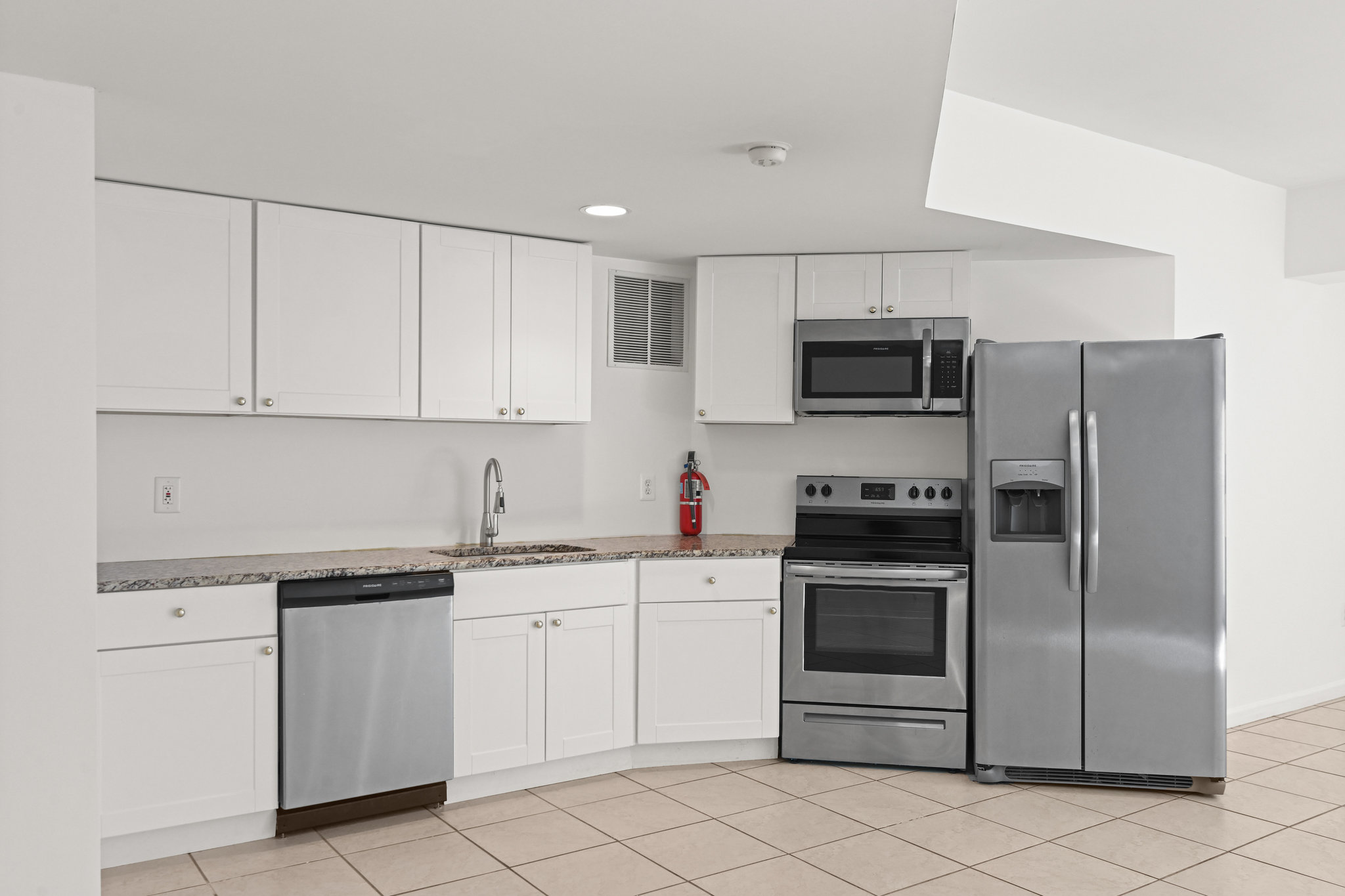 2628 Five Oaks Road Vienna, VA 22181 - Photo 33 of 40 a kitchen with cabinets stainless steel appliances and a counter top