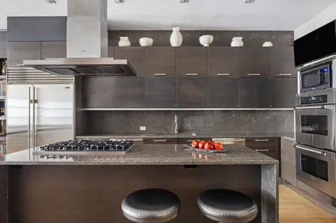 a kitchen with a sink and a stove