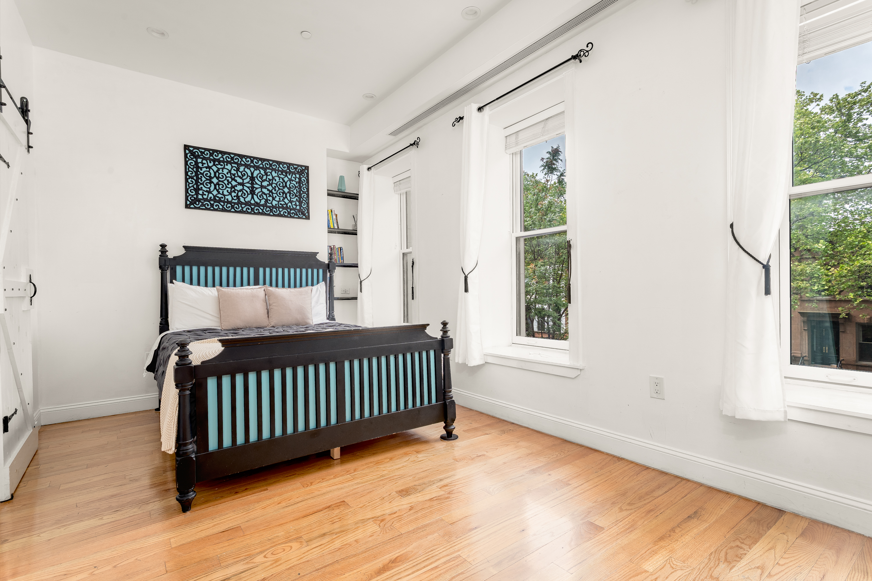 616 MacDonough Street, Unit 2 Brooklyn, NY 11233 - Photo 5 of 12 a view of a bedroom with wooden floor & a window