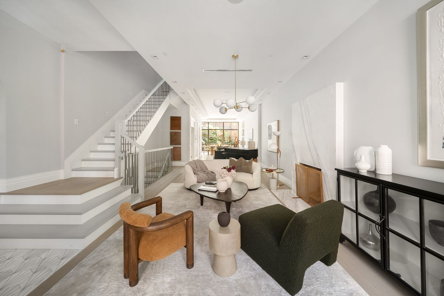 520 East 89th Street Manhattan, NY 10128 - Photo 9 of 40 a living room with furniture and a wooden floor