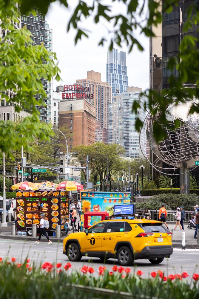 a view of a city with tall buildings
