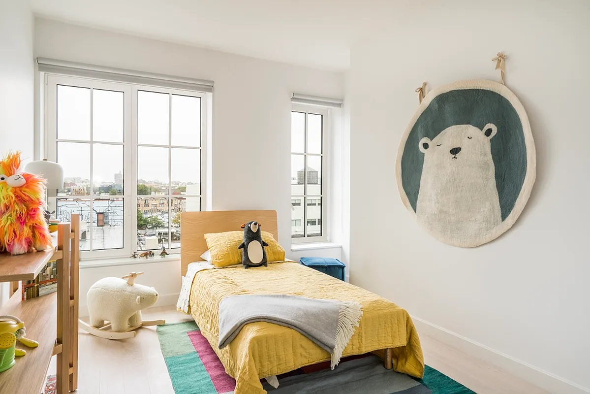 350 Clarkson Avenue, Unit 413 Brooklyn, NY 11226 - Photo 3 of 12 a bedroom with a bed a mirror and windows