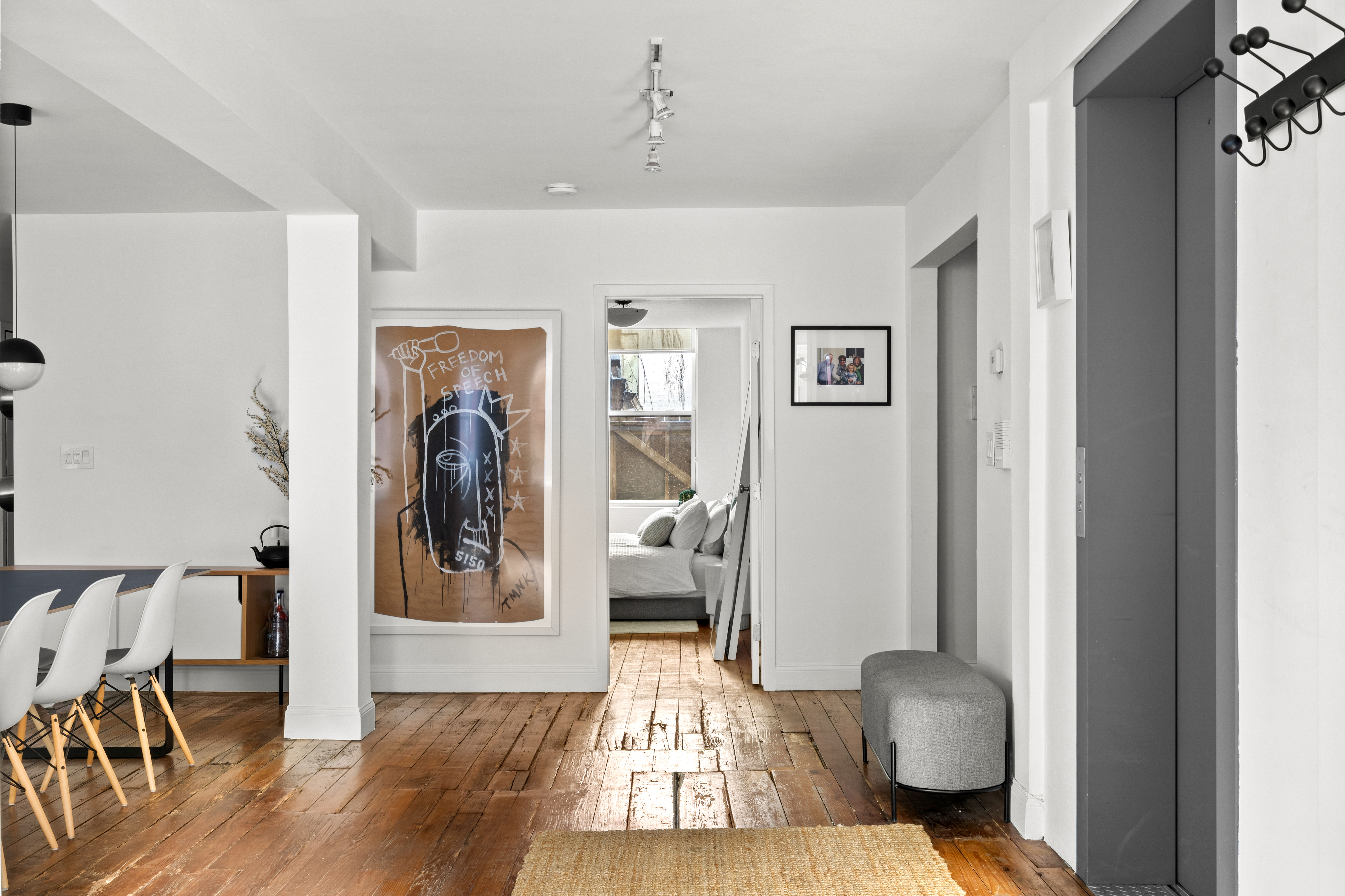 24 Harrison Street, Unit 3 Manhattan, NY 10013 - Photo 5 of 11 a living room with furniture and a mirror