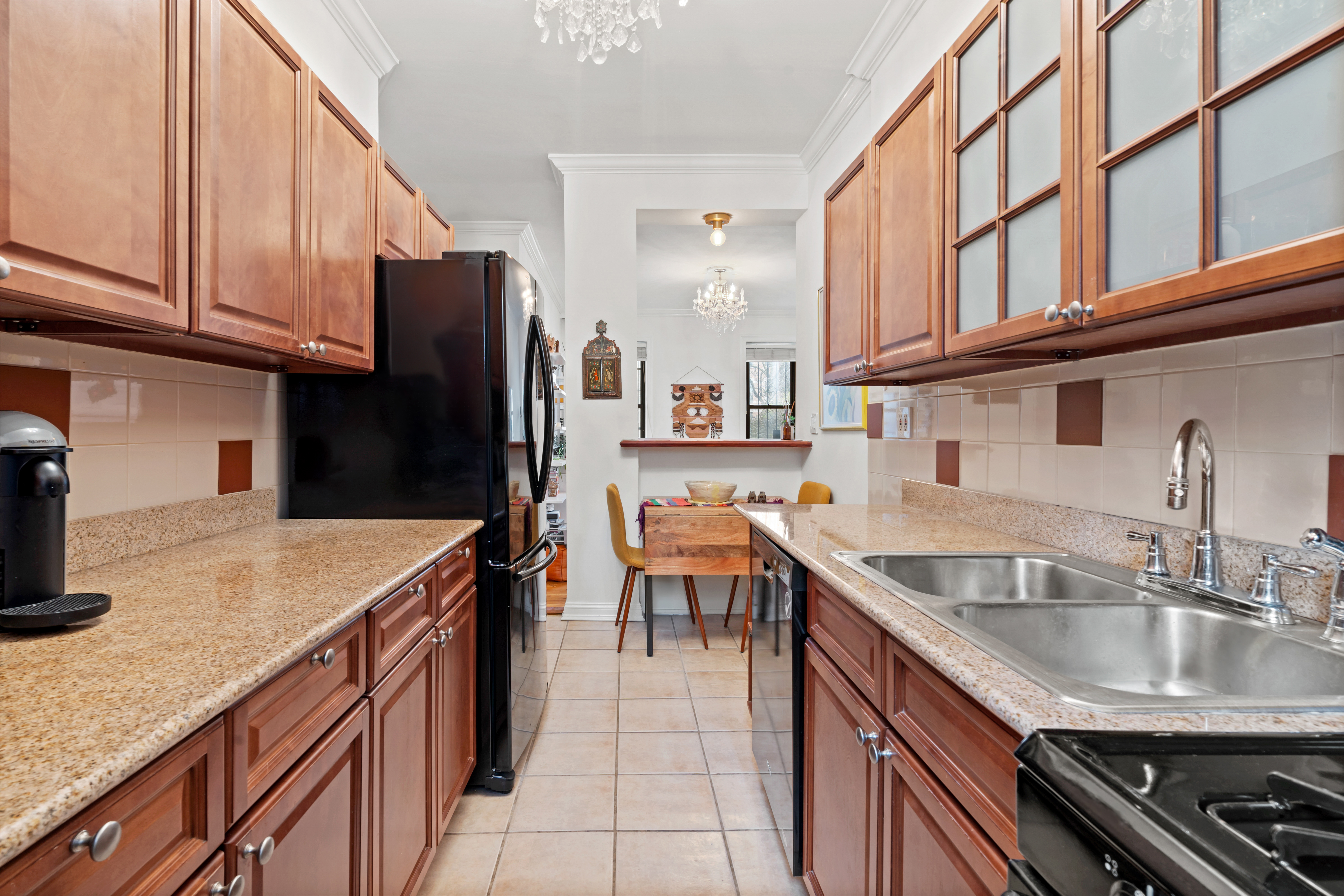 425 Prospect Place, Unit 1J Brooklyn, NY 11238 - Photo 4 of 11 a kitchen with stainless steel appliances granite countertop a sink stove and refrigerator