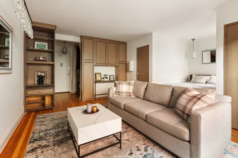 a living room with furniture and a couch