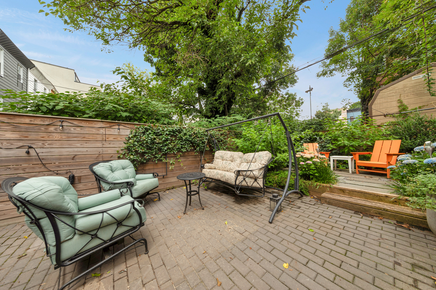 1118 Decatur Street Brooklyn, NY 11207 - Photo 7 of 18 a backyard of a house with outdoor seating
