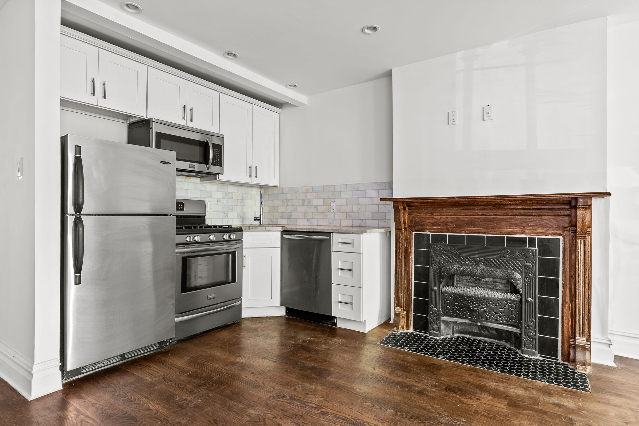 692 10th Street, Unit 1 Brooklyn, NY 11215 - Photo 3 of 12 a kitchen with cabinets and stainless steel appliances