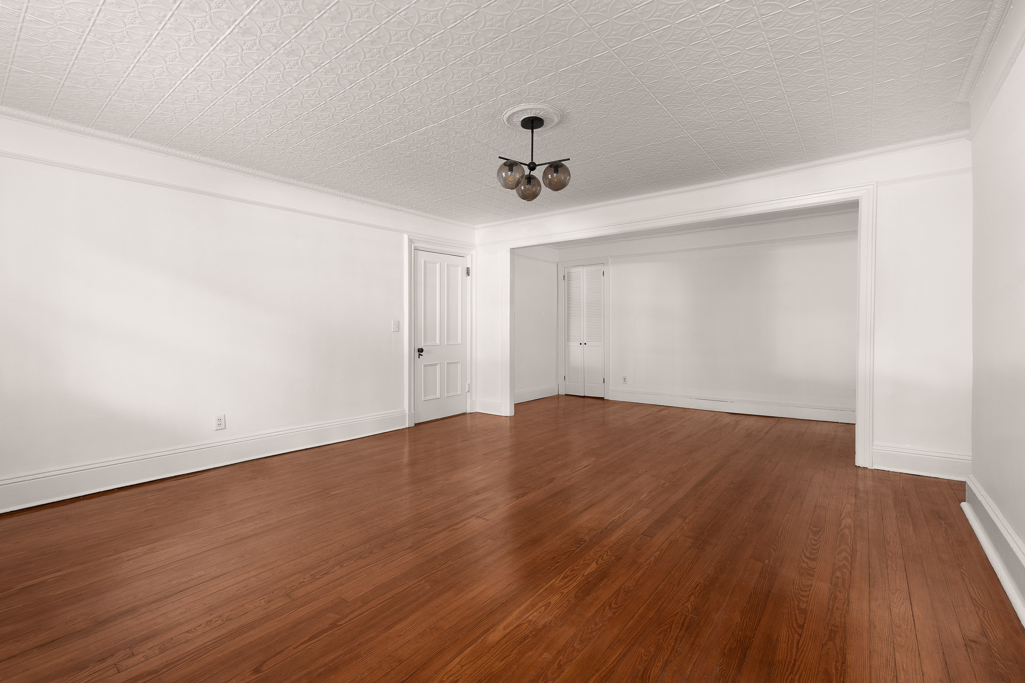 176 Warren Street, Unit GARDEN Brooklyn, NY 11201 - Photo 4 of 9 a view of empty room with wooden floor