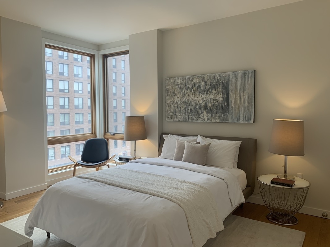 548 4th Avenue, Unit 4B Brooklyn, NY 11215 - Photo 11 of 22 a bedroom with a bed and wooden floor