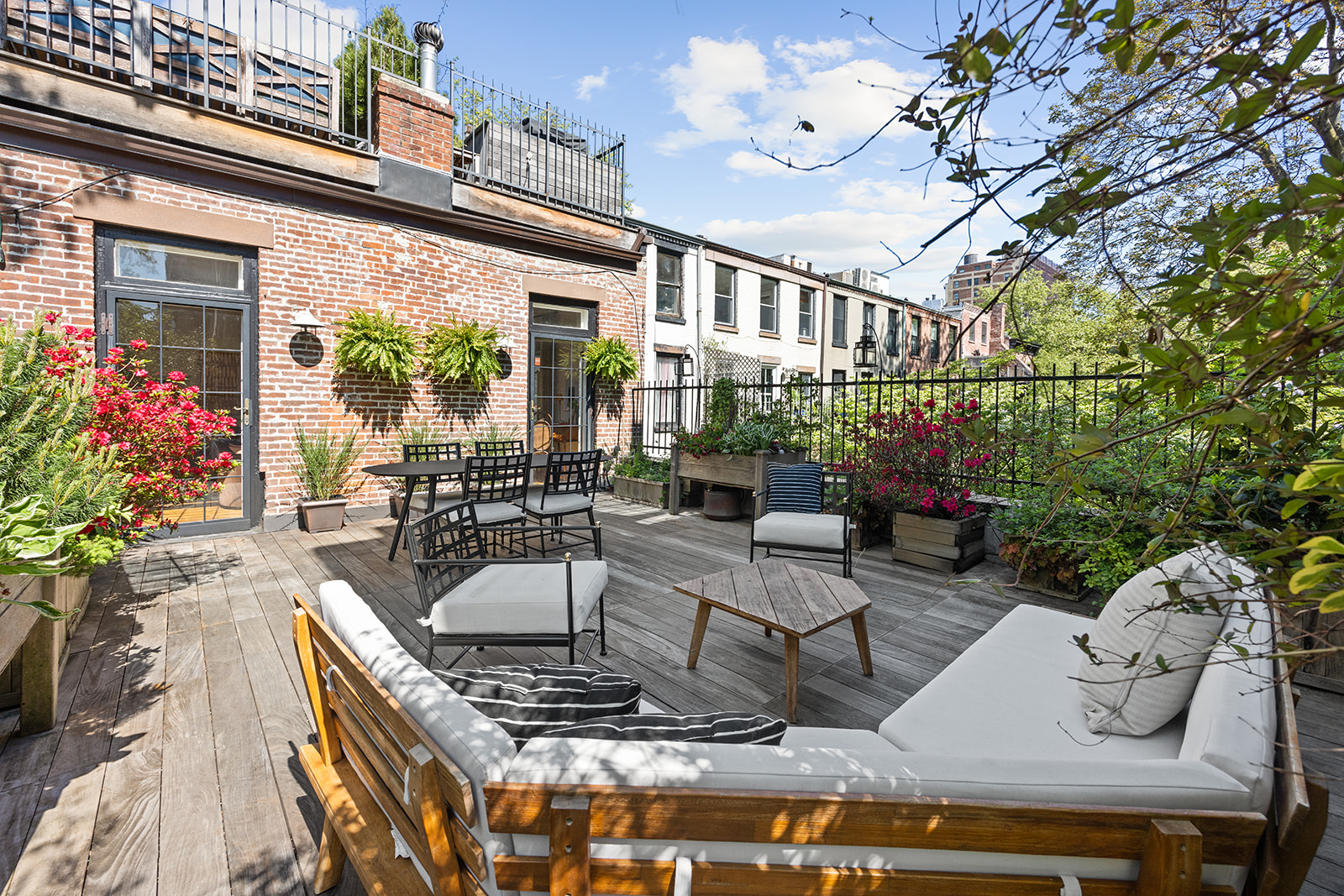 167 Clinton Street, Unit 3 Brooklyn, NY 11201 - Photo 24 of 31 a view of a patio with couches table and chairs and potted plants