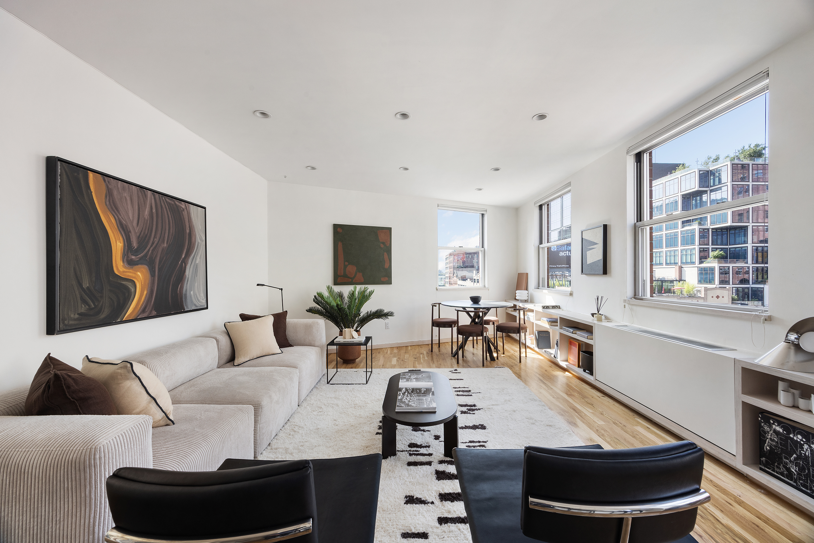 350 West 14th Street, Unit 6D Manhattan, NY 10014 - Photo 3 of 16 a living room with furniture and a large window