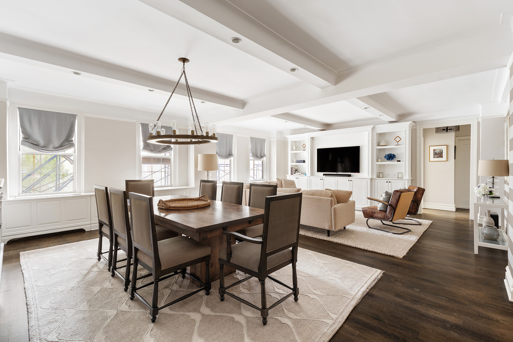 a view of a dining room with furniture window and wooden floor