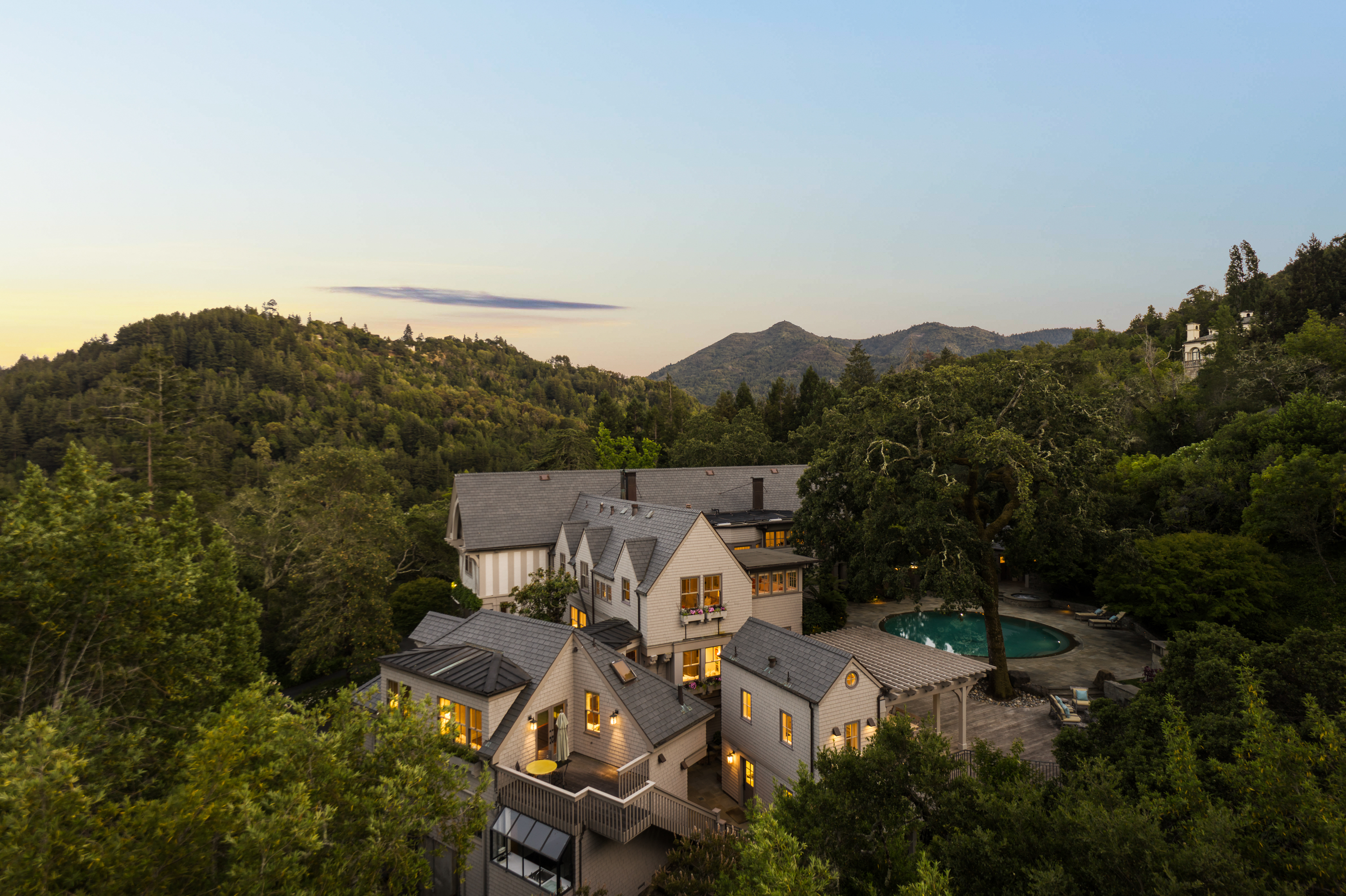 an aerial view of a house with mountain view