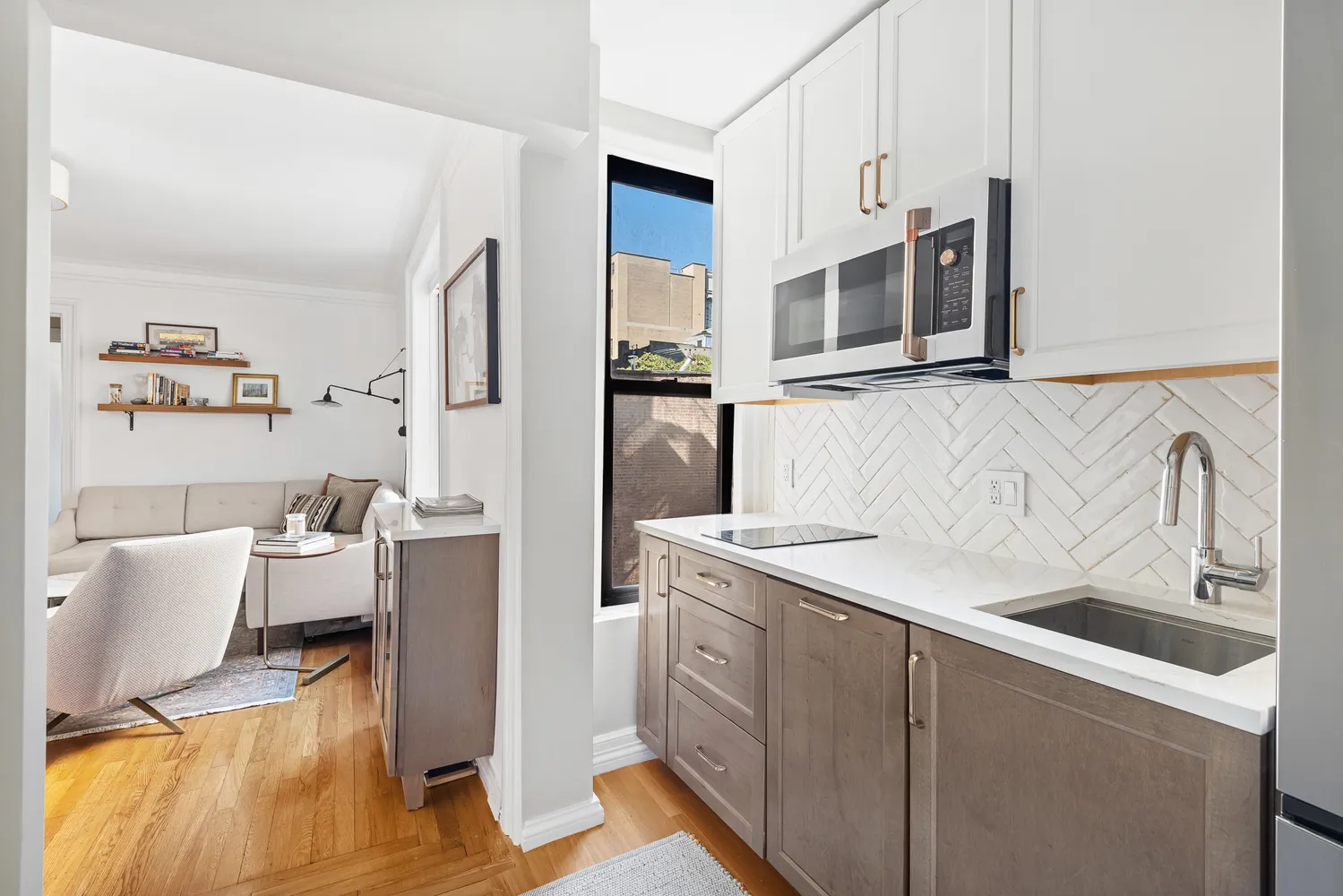 a kitchen with a sink and a refrigerator