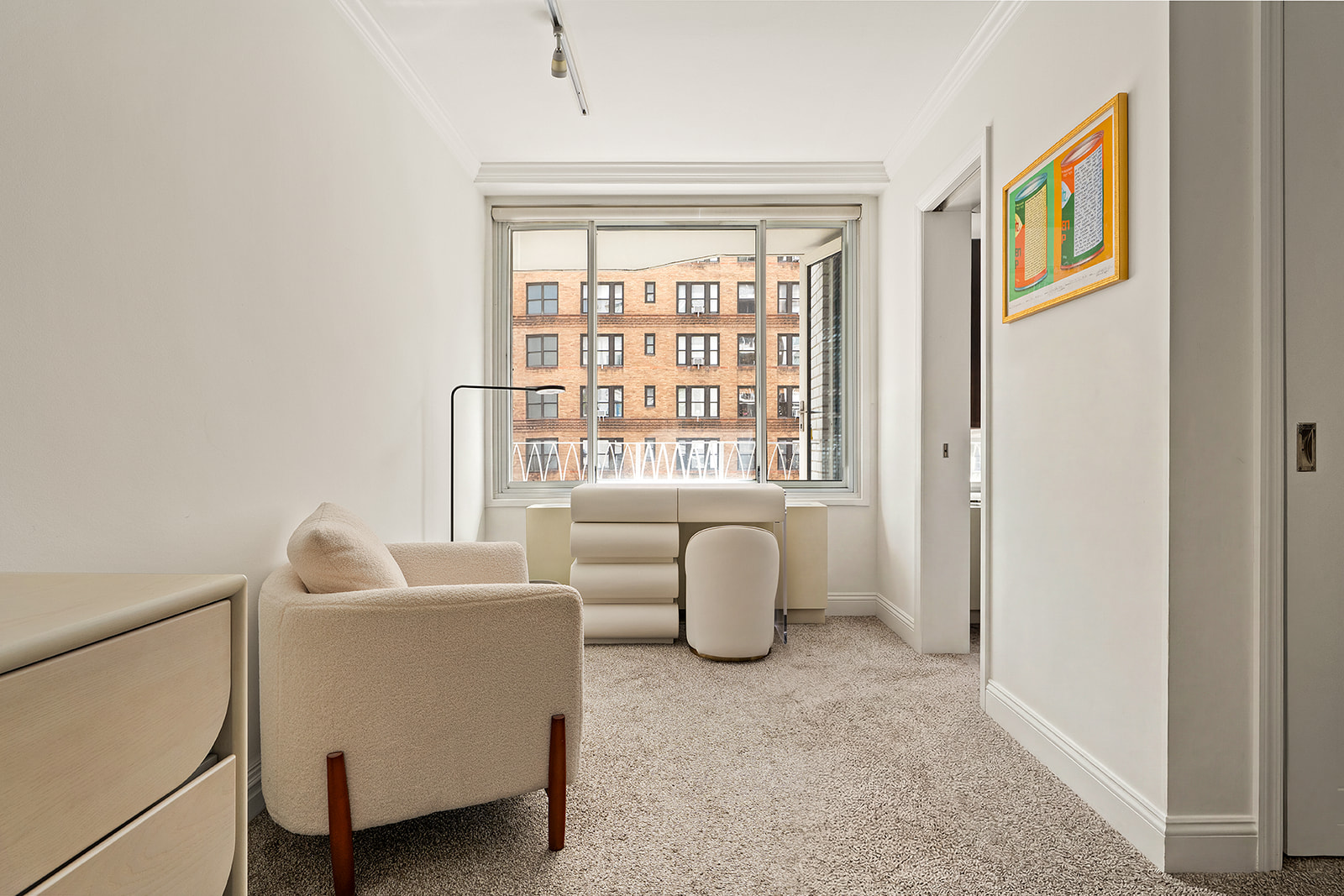 1160 3rd Avenue, Unit 4EF Manhattan, NY 10065 - Photo 5 of 11 a living room with furniture and a window