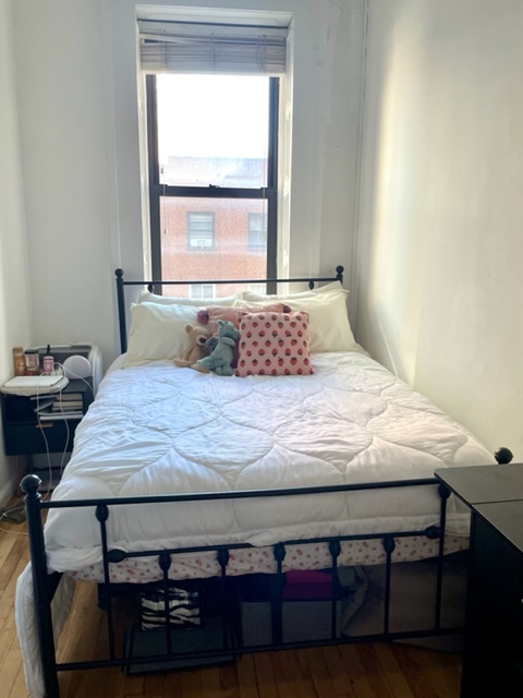 210 East 60th Street, Unit 4 Manhattan, NY 10022 - Photo 4 of 8 a bedroom with a bed a window and dresser