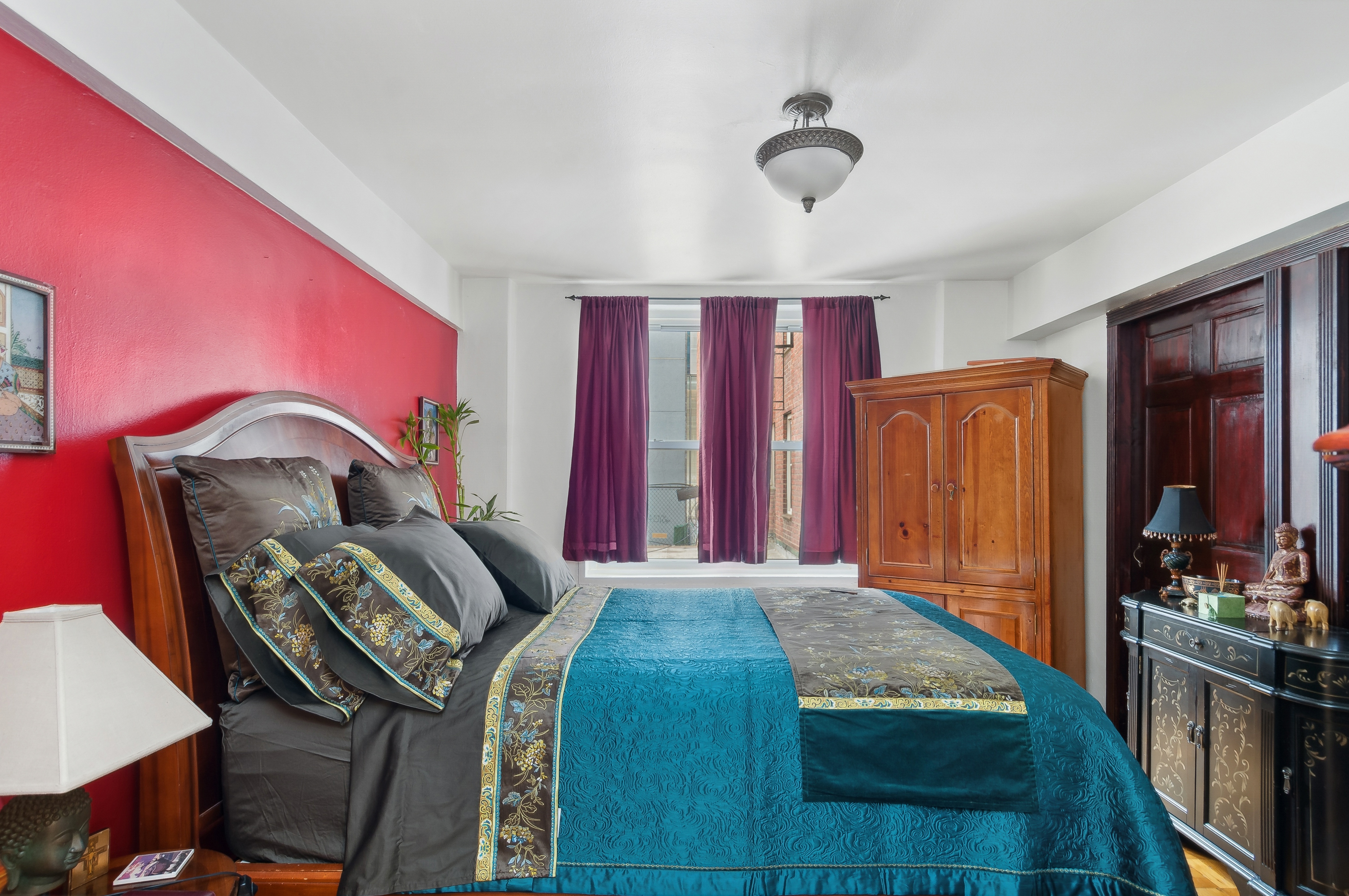 408 West 34th Street, Unit 1F Manhattan, NY 10001 - Photo 8 of 13 a bedroom with a bed next to a window