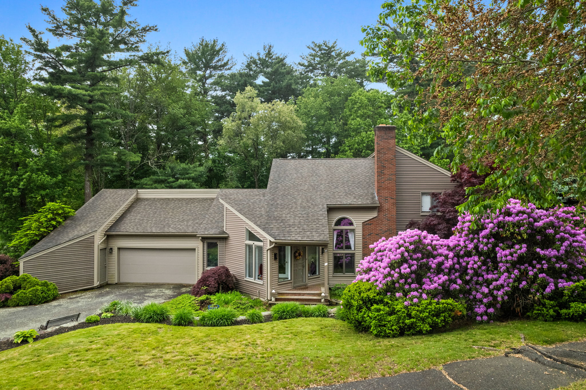 front view of a house with a yard