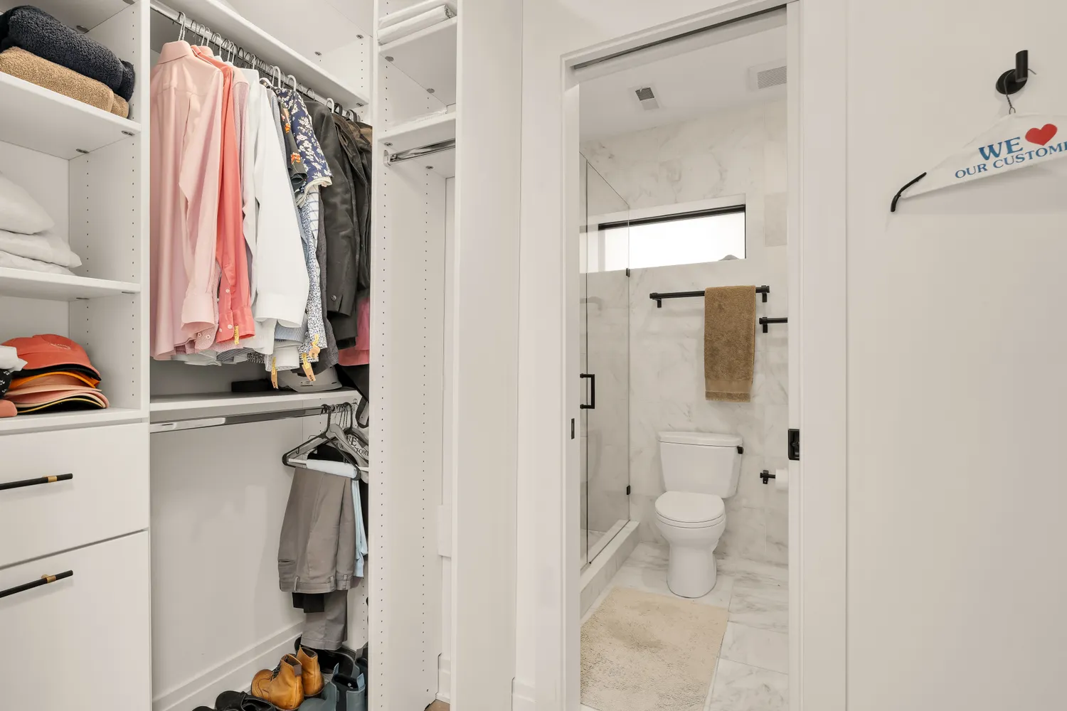 a bathroom with a shower sink vanity and a toilet