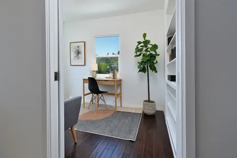 a dining room with a table and chairs