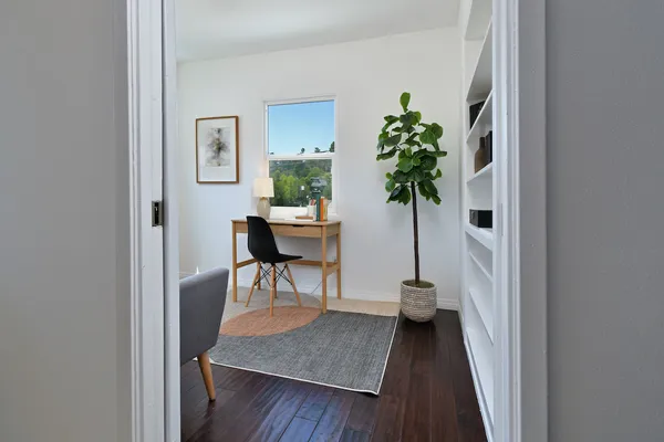 a dining room with a table and chairs