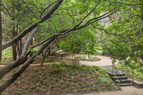 a backyard of a house with yard and outdoor seating