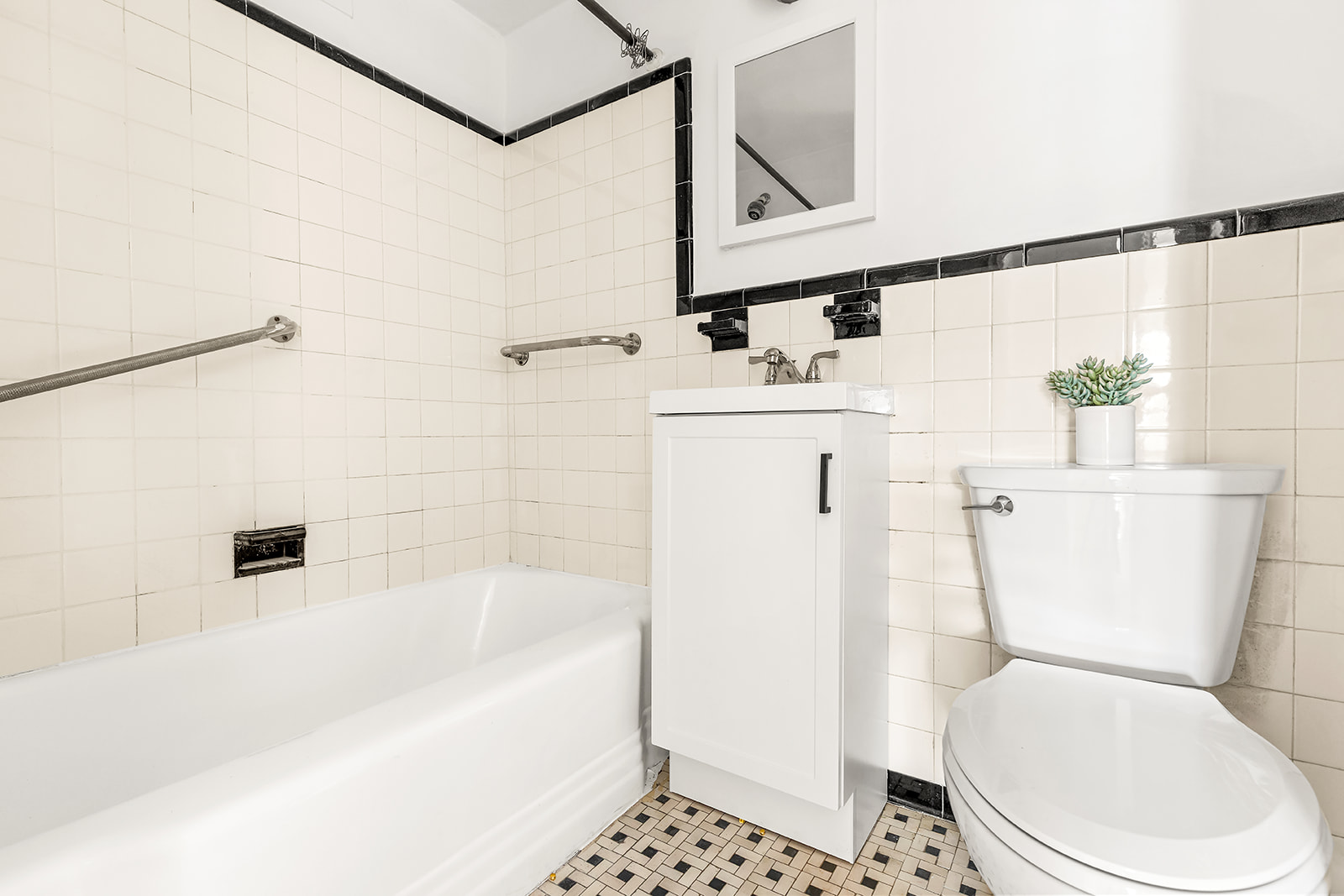 100 Remsen Street, Unit 5G Brooklyn, NY 11201 - Photo 5 of 9 a white toilet sitting next to a bathroom sink