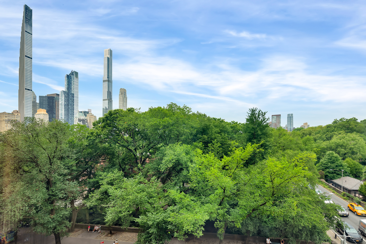 838 5th Avenue, Unit 6 Manhattan, NY 10065 - Photo 20 of 23 an aerial view of a city with lush green space