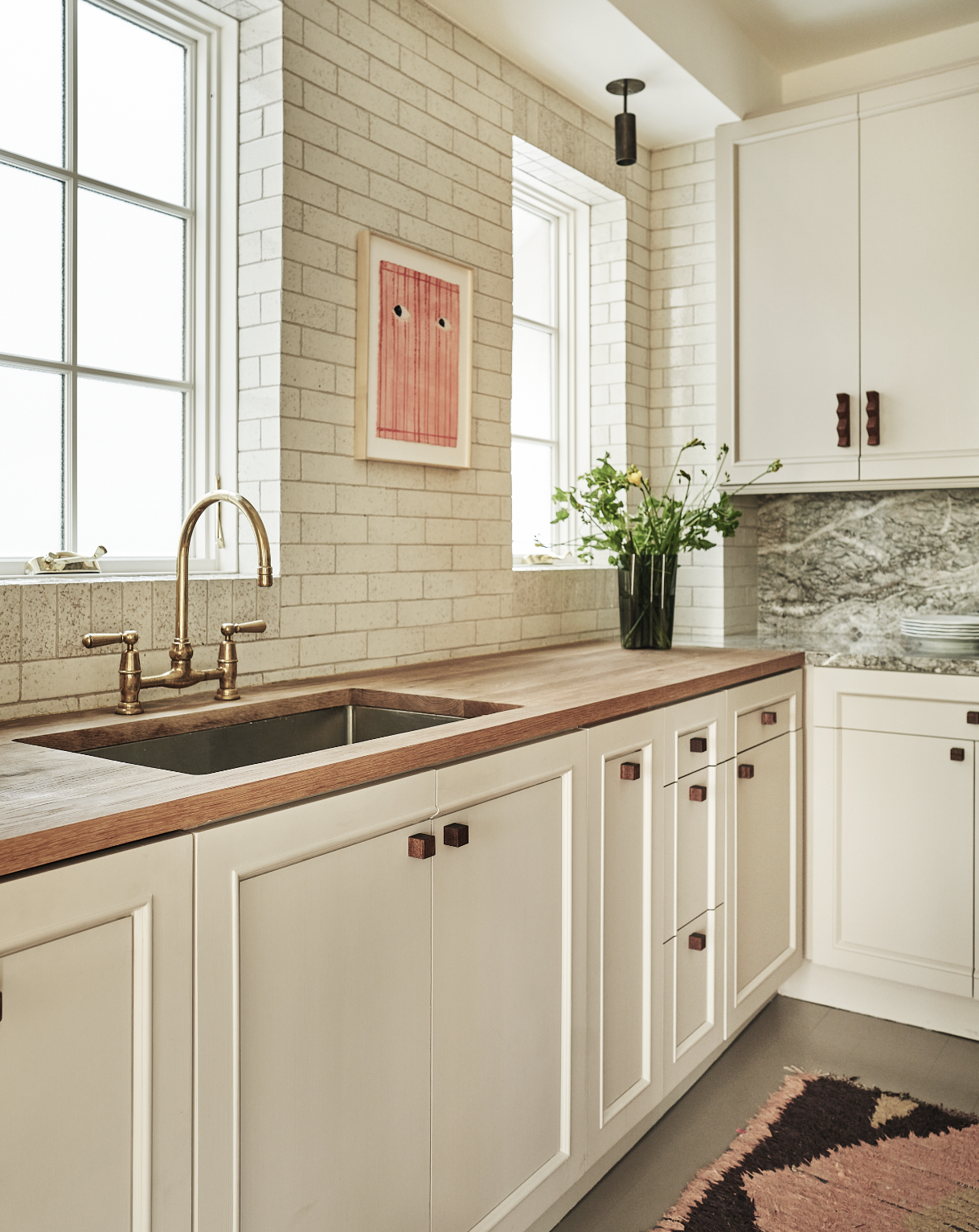 13 Gramercy Park South Manhattan, NY 10003 - Photo 6 of 13 a kitchen with stainless steel appliances white cabinets a sink and a large window