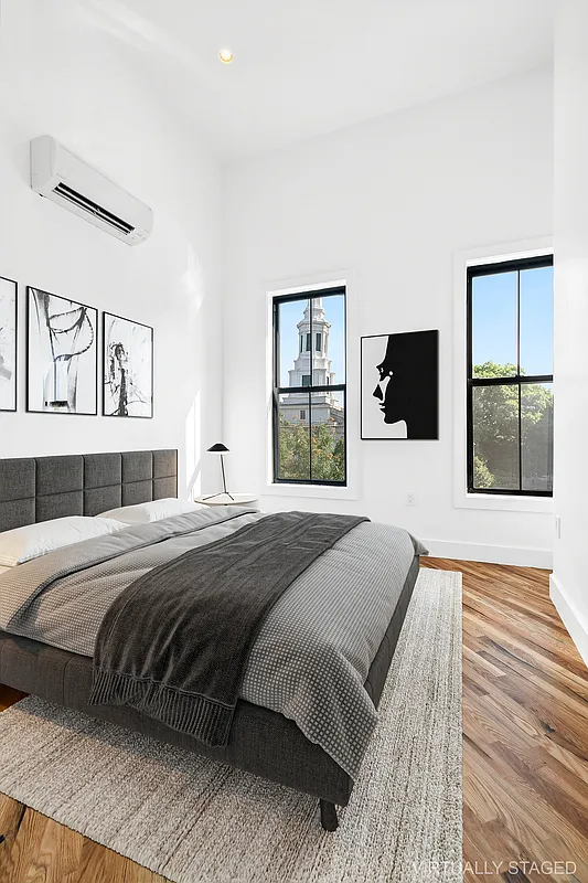 866 Bushwick Avenue, Unit 3 Brooklyn, NY 11221 - Photo 6 of 12 a bedroom with a large bed and a window