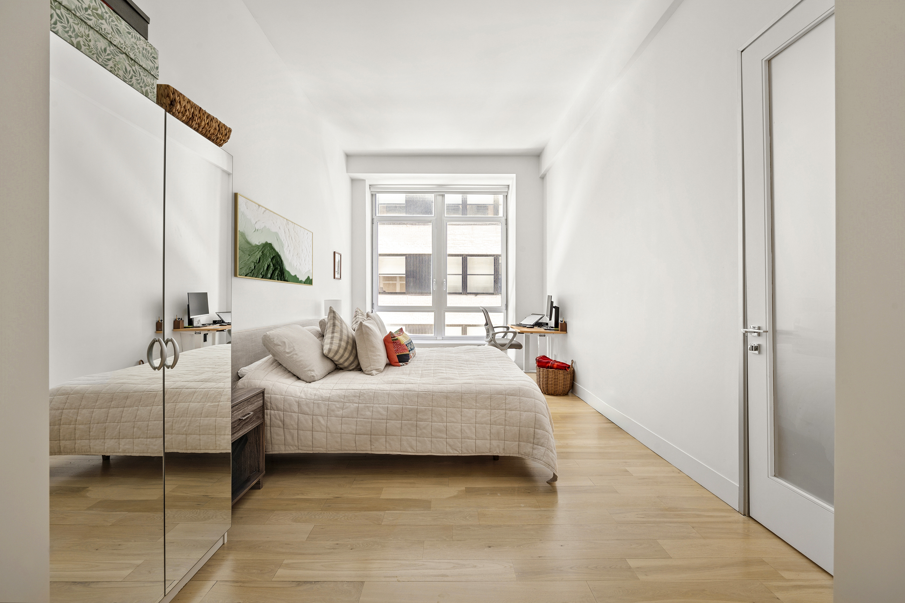 111 Fulton Street, Unit 308 Manhattan, NY 10038 - Photo 4 of 13 a bedroom with a bed and window