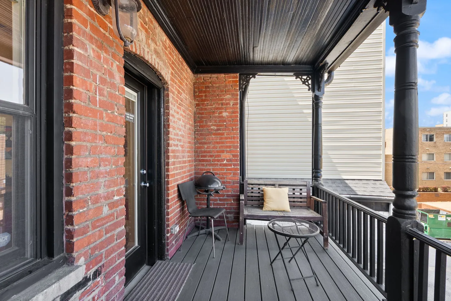 a spacious bedroom with a bed and wooden floor
