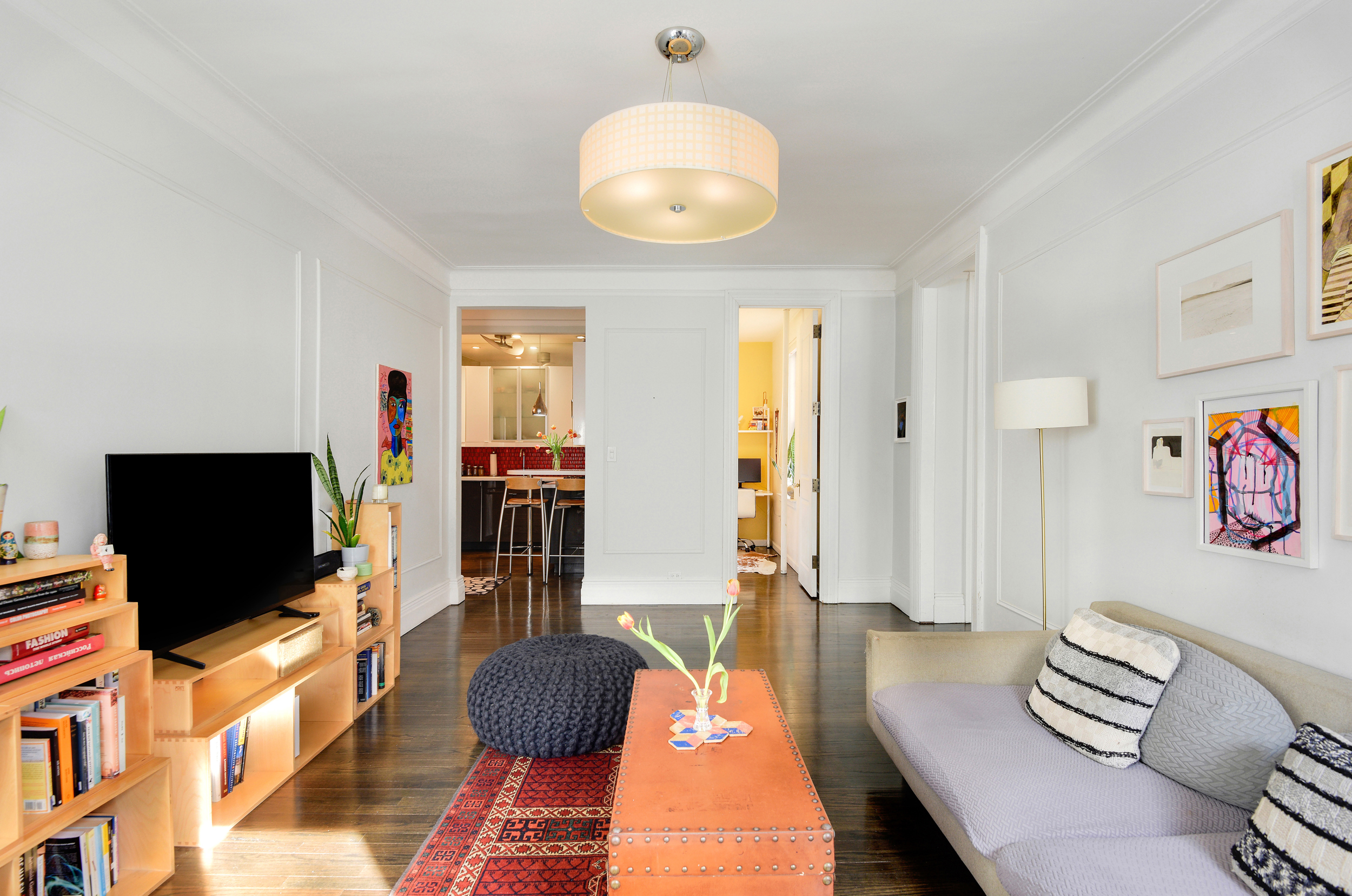 253 West 16th Street, Unit 3A Manhattan, NY 10011 - Photo 3 of 13 a living room with furniture and a flat screen tv