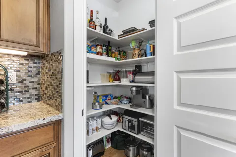 a bathroom with a sink vanity and mirror