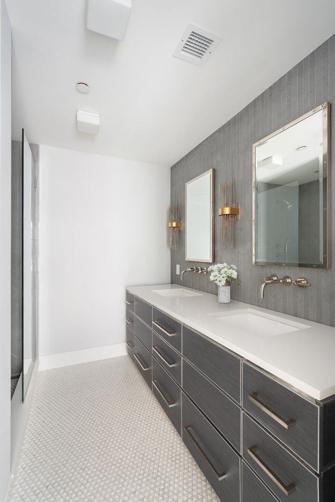 520 East 89th Street Manhattan, NY 10128 - Photo 26 of 40 a bathroom with a double vanity sink and mirror