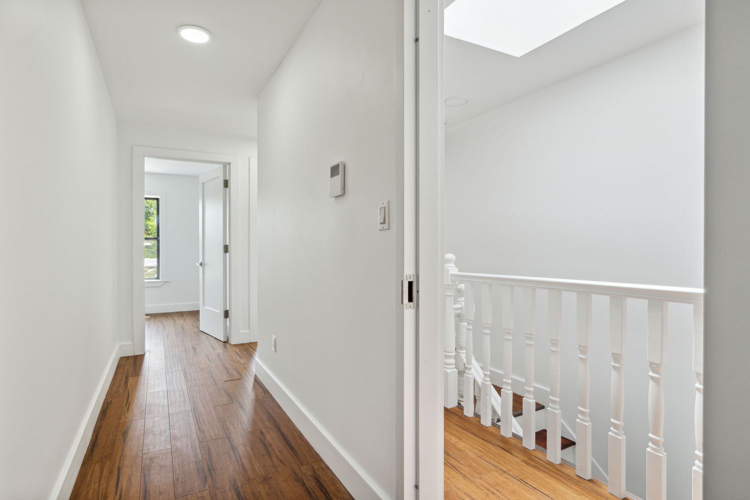 692 Putnam Avenue, Unit 2 Brooklyn, NY 11221 - Photo 5 of 15 a view of hallway with wooden floor
