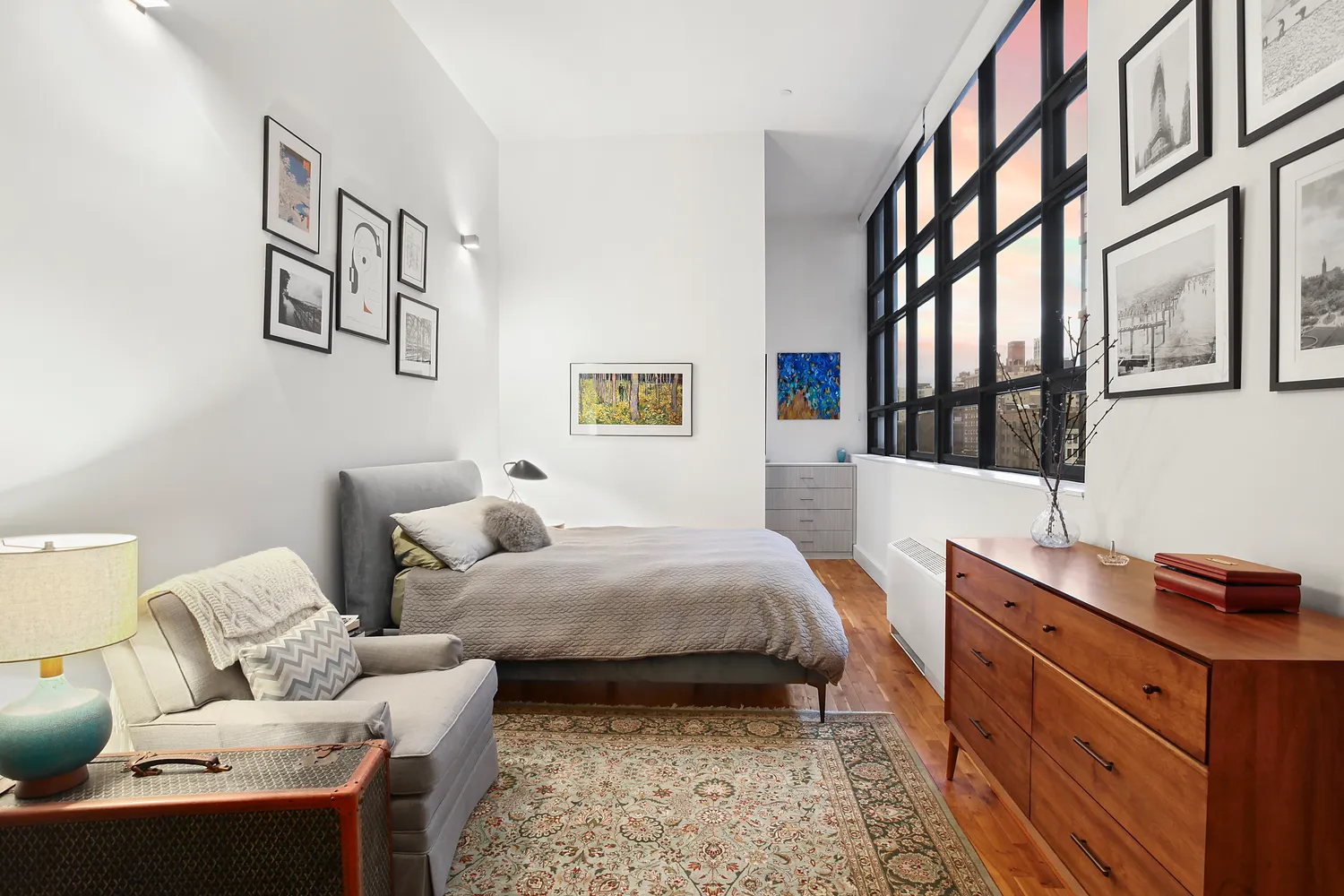 a bedroom with a bed and a desk