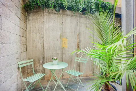 a view of a table and chairs in patio