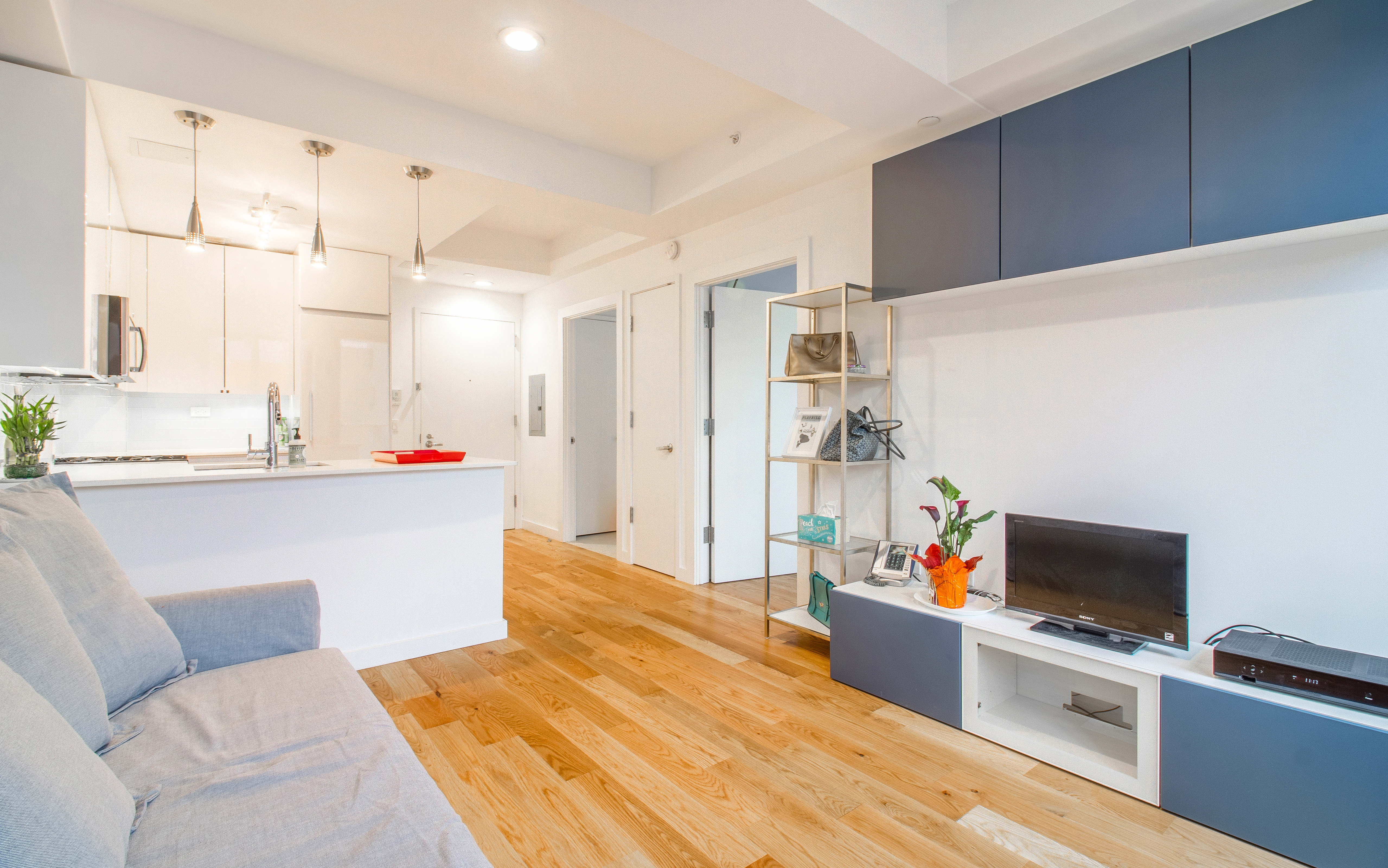 51 East 131st Street, Unit 6A Manhattan, NY 10037 - Photo 6 of 12 a bedroom with a bed and a television in it