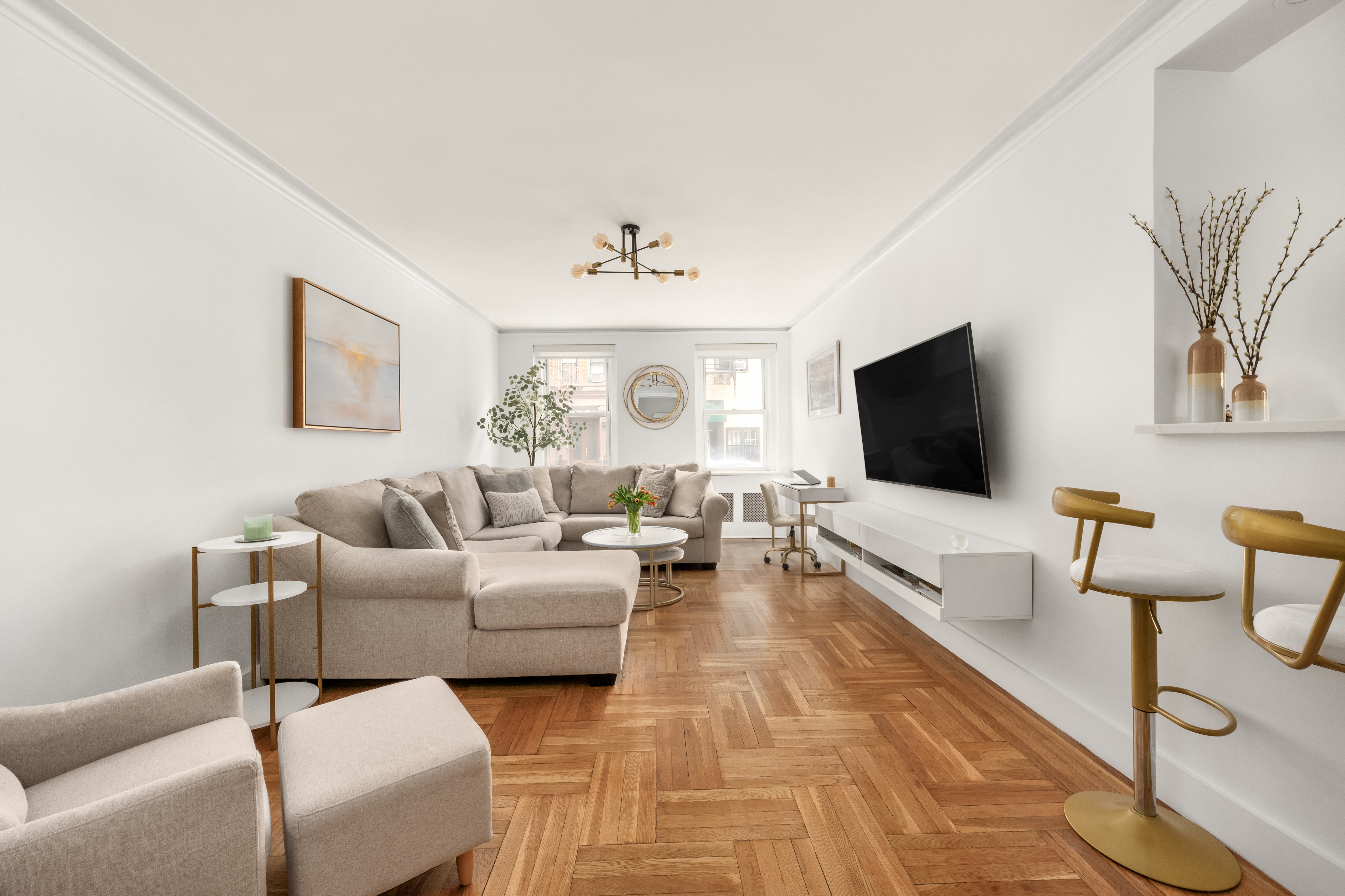325 East 77th Street, Unit 1E Manhattan, NY 10075 - Photo 4 of 8 a living room with furniture and a flat screen tv