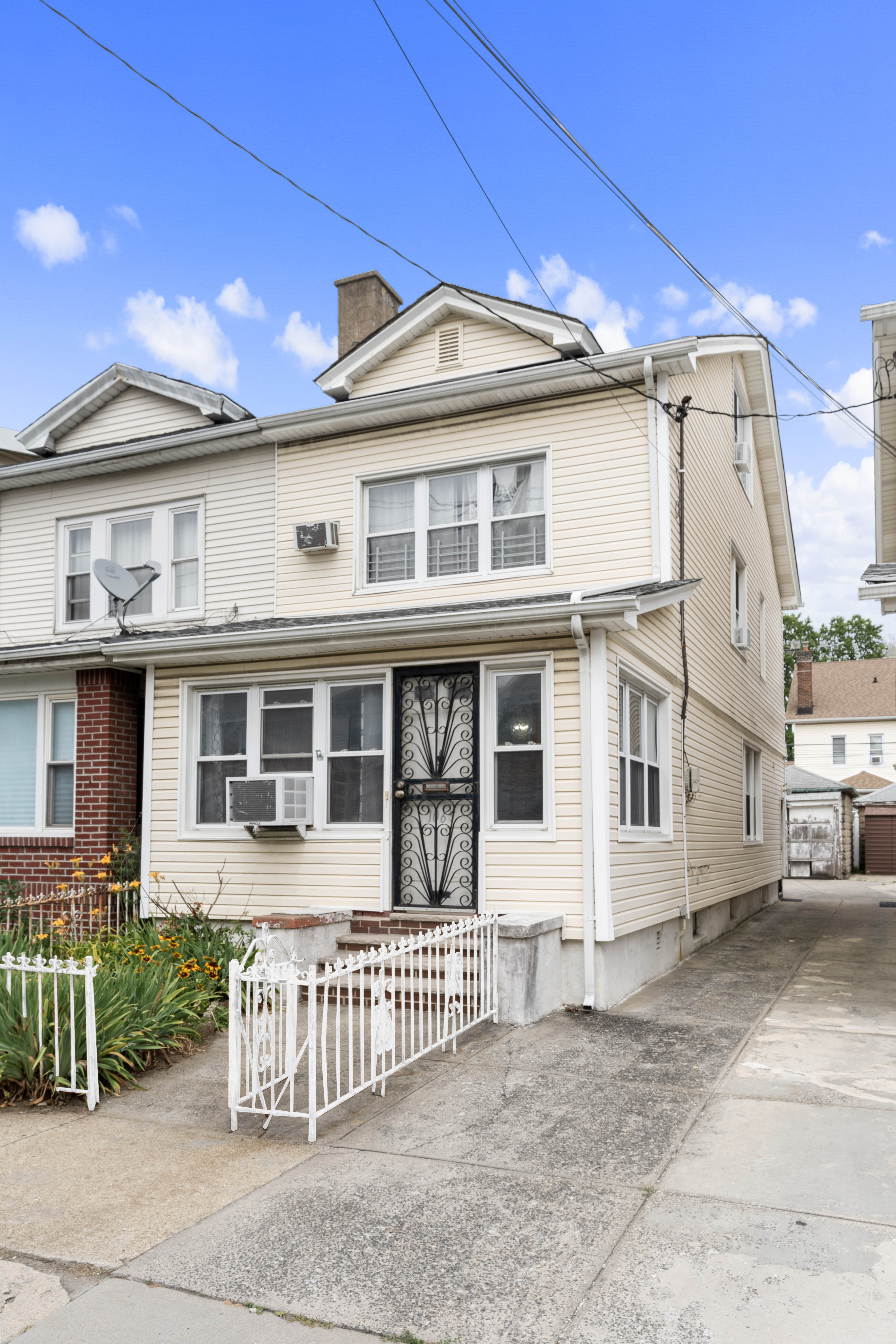 1065 East 39th Street Brooklyn, NY 11210 - Photo 10 of 15 a front view of a house with a porch