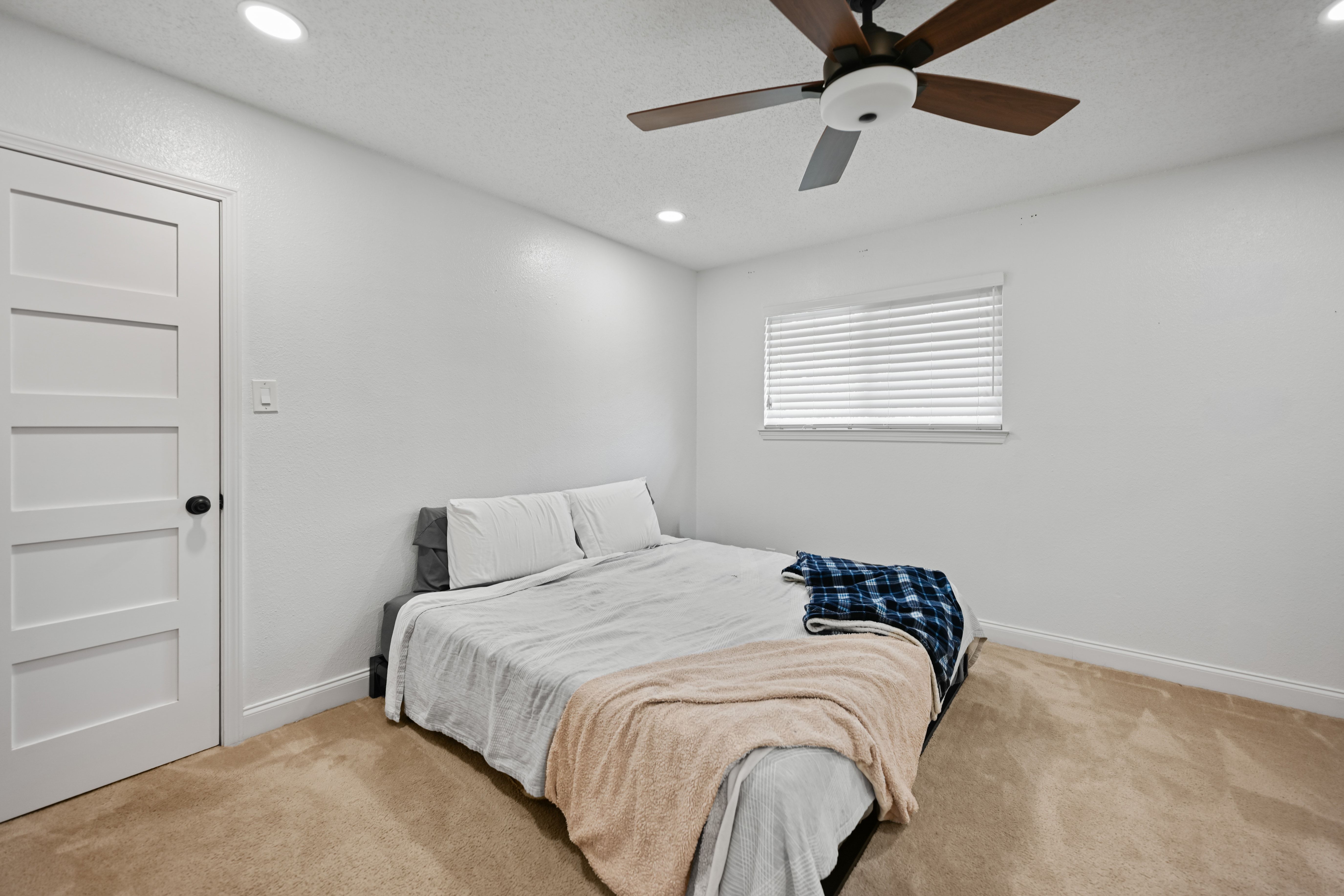 8710 Clearbrook Trail Austin, TX 78729 - Photo 12 of 28 a bedroom with a bed and a window