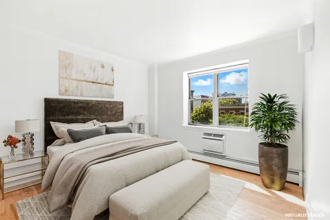 a bathroom with a bathtub a sink and a shower