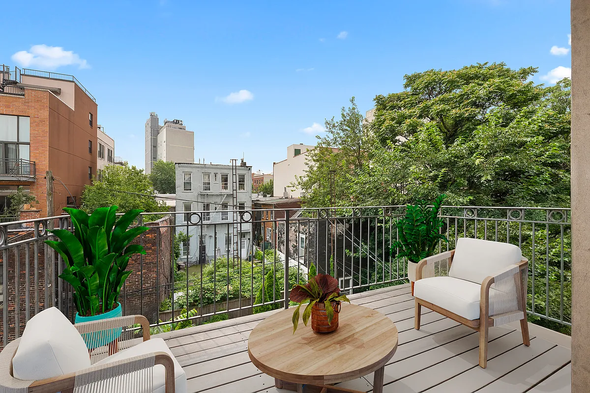 a view of a chair and tables in the terrace