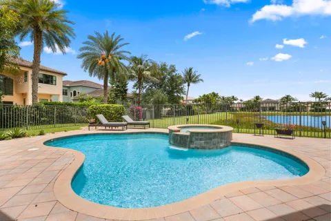 a view of a swimming pool with a lounge chair
