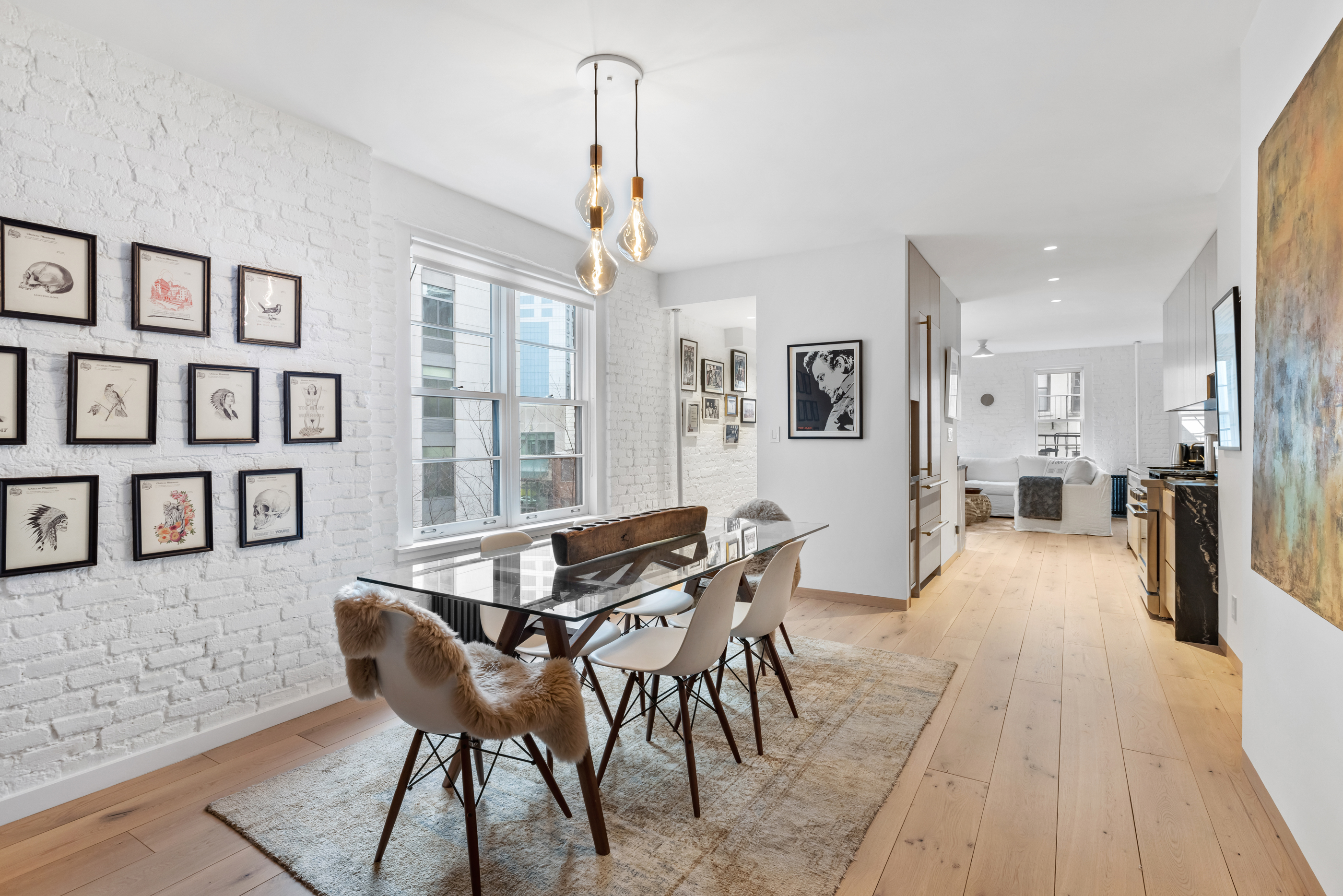 57 Thompson Street, Unit 4E Manhattan, NY 10012 - Photo 1 of 16 a view of a dining room with furniture and a table