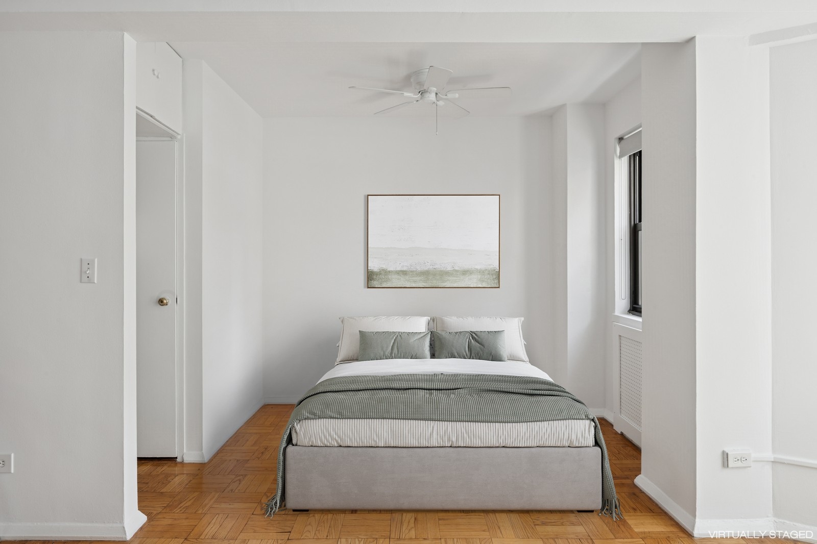 305 East 72nd Street, Unit 10G Manhattan, NY 10021 - Photo 3 of 6 a bedroom with a bed and wooden floor